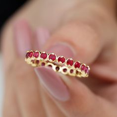 Product Details This Ruby Ring is unique and a beautiful jewelry for your loved ones. It features with Round Cut Ruby in full eternity pattern in Bezel Setting on Eternity Ring. This Full Eternity Ring is crafted in Solid Gold. Either go alone or stack it with other rings, in both the ways it will look flawless. Product Information SKU SHP-RINGS0821169419 Width 1.7 mm Height 3.2 mm Weight 2.40 gm (Approximate) RUBY INFORMATION No.of Stones 21 Pieces Total Weight 2.08 Carat (Approximate) Dimensio 3 Stone Ruby Ring, Full Eternity Ring, Stackable Ring, Ruby Ring, Stackable Rings, Bezel Setting, Eternity Ring, Round Cut, Beautiful Jewelry