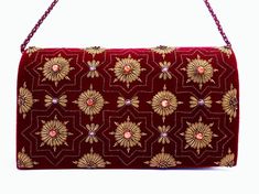 "Burgundy velvet clutch bag, zardozi evening bag, embroidered with copper medallions and embellished with genuine semi precious stones, to give an opulent, multidimensional dazzling effect. This is a gorgeous wardrobe investment piece! A classic design that will never go out of style! A modern heirloom to be cherished! Add instant glamour and elegance to any ensemble! Perfect for any evening occasion, be it wedding, gala, cocktail party. The word Zardozi means \"gold thread\". It is an elaborate Formal Festive Evening Bag With Gold Embroidery, Festive Formal Evening Bag With Gold Embroidery, Embellished Clutch For Formal Festivals, Rectangular Gold Embroidered Evening Bag, Festive Rectangular Evening Bag With Gold Embroidery, Formal Evening Bag With Zari Work For Festivals, Formal Rectangular Bag With Mirror Work, Festive Gold Embroidered Rectangular Evening Bag, Mirror Work Clutch For Evening Reception