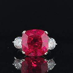 GORGEOUS VINTAGE 14K WHITE GOLD ENGAGEMENT RUBY RING CENTER LAB GROWN RUBY IN CUSHION SHAPE WEIGHT 9.23CARAT size 12x12MM GORGEOUS GEMSTONE RED RUBY IN CUSHION SHAPE. VERY NICE CUT ,LIVELY STONE.CLEAN ,GORGEOUS COLOR ,VERY BRILLIANT AND SPARKLY. SIDE SET TWO ROUND NATURAL DIAMONDS WEIGHT 1.37CT SIZE 5.7MM H-SI1 SPARKLY DIAMONDS LIVELY BRILLIANT, NICE CUT WHITE BRIGHT STONES. RING size 7 RESIZABLE Retail value $7,500 net. Appraisal available Cushion Cut Ruby Ring, Red Diamond Ring With Brilliant Cushion Cut, Red Cushion Cut Brilliant Diamond Ring, Red Cushion Cut Diamond Ring With Brilliant Cut, Luxury Gia Certified Cushion Cut Ruby Ring, Luxury Red Cushion Cut Ruby Ring, Gia Certified Cushion Cut Ruby Ring For Formal Occasions, Formal Gia Certified Cushion Cut Ruby Ring, Luxury Asscher Cut Ruby Ring