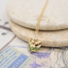 🎉Dainty enamel lily of the valley pendant necklace 🎉Design and handcraft in our Burlington Studio ------------------------------------------------------------- PRODUCTS DETAILS Pendant: 15X12mm Pendant: 14K gold plated enamel Chain and findings: 14K gold filled Chain length: 16"/18"/20"/22" available from drop-down list, other length pls leave me a message for customization Model: 18" chain ------------------------------------------------------------- SAME COLLECTION Earrings https://www.etsy. Wedding Pendant Necklace In Enamel, Yellow Gold Enamel Necklace For Wedding, Gold Enamel Necklace For Wedding, Lily Of The Valley Necklace, Lily Of The Valley Jewelry, Jewelry Bride, Hydrangea Not Blooming, Jewelry Accessories Ideas, Wedding Party Jewelry