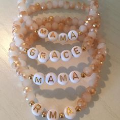 Glass Peach/White beaded bracelet accented with gold-filled spacer beads and gold letter beads. Letter beads can be customized to say any word, name or date. *Price is for ONE glass peach beaded bracelet Message your name/word/date or initials. EXAMPLE: MAGGIE .MAGGIE. M.G.A. 1.21.14 - Use a period if you want a bead spacer J.(heart).M J(heart)M - Do not use a period if you do not want a bead spacer Mother's Day Beaded Stretch Bracelet With Round Beads, Beaded Stretch Bracelet For Mother's Day, Stretch Beaded Bracelet For Mother's Day, Gold Beaded Stretch Bracelet For Mother's Day, Gold Heishi Beads Bracelets With 8mm Beads, Mother's Day Beaded Crystal Bracelet With Round Beads, Spiritual Beaded Name Bracelet With Round Beads, Spiritual Beaded Name Bracelet, Mother's Day Beaded Crystal Bracelet