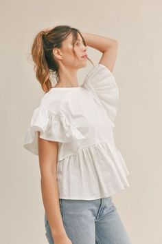 Ruffle sleeve top and asymmetrical ruffle hem detail front peplum t-shirt top. Chic Short Sleeve Tops For Brunch, Summer Ruffle Top With Flutter Sleeves, Summer Tops With Ruffles And Flutter Sleeves, Spring Ruffled Tops For Day Out, Chic Peplum Top With Ruffles, Chic Tops With Ruffle Hem, Ruffled Cotton Short Sleeve Top, Spring Puff Sleeve Top With Ruffle Hem, Feminine Fitted Top With Ruffles