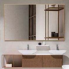 a modern bathroom with two sinks and a large mirror above the sink is an open shelf