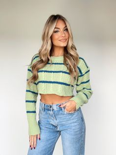 Combine luxury and style with the Cool Factor Sweater. This cable knit, striped sweater features a rounded neckline, textured fabric, and a drop shoulder for maximum comfort, making it perfect for brunch or casual shopping. The colors are bright and the statement vibes are elevated and trendy, adding a fun pop of color and a perfect finishing touch to any ensemble. 100% Polyester Hand wash cold. Striped Long Sleeve Cable Knit Sweater, Trendy Textured Knit Sweater, Trendy Textured Knit Cropped Sweater For Layering, Green Textured Knit Cropped Sweater With Crew Neck, Trendy Green Cable Knit Tops, Trendy Ribbed Knit Cropped Sweater, Trendy Striped Crew Neck Sweater, Trendy Striped Sweater For Fall, Trendy Striped Cropped Sweater