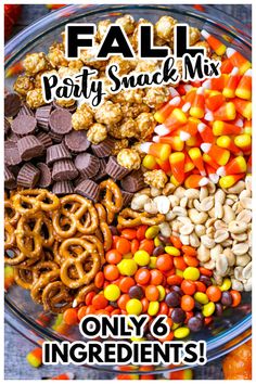 a bowl filled with candy corn, pretzels and other snacks for fall party snack mix