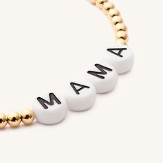 Trying to find a meaningful + unique gift for any person? These custom name bracelets are perfect for every occasion. Gift the new mother a "mama" bracelet or her child’s name; gift your BFF matching name bracelets; show some teacher appreciation with a custom bracelet. The options are limitless, and these bracelets will stack perfectly with our plain small and large gold beads. 14k Gold Fill 3 mm All bracelets are made to 6.2 inches and stretch to 7. Please measure wrists accordingly. All items Custom Name Bracelets For Mother's Day, Personalized Name Beaded Bracelets For Mother's Day, Personalized Mother's Day Beaded Name Bracelets, Adjustable White Name Bracelet With Custom Text, Mother's Day Stretch Bracelet With Letter Beads, Mother's Day Name Bracelet With Letter Beads, Meaningful Round Beads Name Bracelet As Gift, Meaningful Name Bracelet With Round Beads As Gift, Personalized White Beaded Bracelets For Mother's Day