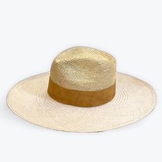 The Distressed Gold Straw Hat by The Hip Hat beautifully combines a crocheted distressed golden crown with a natural large brim weave, all intricately handcrafted with Toquilla Straw by expert artisans in Ecuador. This one-of-a-kind luxury hat exudes old money holiday vibes. Featuring a gorgeous removable suede hat-band this is the ultimate classy hat for the summer. Striking distressed gold crocheted crown 5" brim and a 4-4.5" crown (these measures can vary from one hat to another) Elegantly en Old Money Holiday, Crocheted Crown, Classy Hat, Gold Straws, Crochet Crown, Classy Hats, Suede Hat, Luxury Hats, Sweat Band