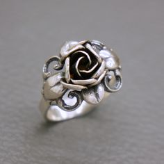 An elegant vintage sterling silver flower design ring. The famous Biedermeier rose flower design by TEKA  (TEKA studio in Pforzheim, Germany, was founded by Theodor Klotz in late 1940's). A high quality hand crafted mid century German design jewelry from circa 1950's. The ring will be shipped in a gift box.   Ring size: 16.3 mm in diameter / US size: 5 3/4  /  UK size: L 1/4 / EU size : 52 Ring face measures 3/5 inches tall (1.5 cm) Weight: 4.1 grams The ring was hallmarked for 925 sterling silv