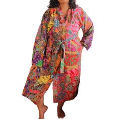 "This is a washable printed batik robe/ kimono long, handmade by artisans. Two side pockets Removable waist tie closure Belt loops and inside ties to secure closure Side slits at hem Machine washable in cold and machine dry in delicate setting. This is made of printed batik fabric and not wax and dye batik fabric. Cotton Kimono, Kimono for Women, Woman Kimono, Women robe, Woman Robe, Batik Clothing, Batik Robe, Batik Kimono, Artisan Clothing, Cotton Robe, Woman Cotton Robe, Grey, Grey Robe, Grey Red Cotton Robe For Spring, Multicolor Bohemian Kimono For Home, Multicolor Cotton Kimono For Home, Bohemian Red Cotton Kimono, Multicolor Cotton Robe For Festival, Bohemian Printed Kimono, Multicolor Long Cotton Robe, Long Multicolor Cotton Robe, Bohemian Printed Home Kimono