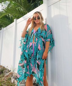 The ultimate tropical beach cover up for vacays and beach days, this cute swim cover up dress with tassel trim features a dreamy pink and green monstera leaf palm print. One size fit most. Hand wash & hang dry only Material: 100% Viscose Beachy Tropical Print Cover-up For Beach, Summer Tropical Print Poolside Cover-up, Green Floral Print Summer Cover-up, Spring Tropical Print Cover-up For Poolside, Beach Party Tropical Print Cover-up, Beachy Green Cover-up With Tropical Print, Green Cover-up For Beach Party Vacation, Tropical Printed Cover-up For Resort Season, Summer V-neck Cover-up With Tropical Print