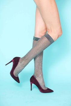 Featuring a timeless herringbone design in a sophisticated gunmetal metallic design with a wide elasticated band to prevent them slipping that can be styled a variety of ways- slouchy around the calf or pulled up at the knee. These socks are an instant fashion game-changer and can be effortlessly paired with booties, boots, heels or flats. Wear them with skirts, dresses or peeking out under jeans or pants. – 80% Chinlon, 20% Spandex – Hand wash – One size, comfortably fits a US size 5-10 / EU si Metallic Socks, Lauren Lane, Pilates Workout Routine, Boot Camp Workout, Diva Boutique, Metallic Design, Gym Workout Outfits, Herringbone Design, Yoga Accessories