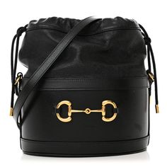 This is an authentic GUCCI Azalea Sakai Calfskin Horsebit 1955 Drawstring Bucket Bag in Black. This stylish shoulder bag is crafted of luxuriously textured calfskin leather in black. The bag has a sturdy base with a cinch-cord top. The bag also features an adjustable leather shoulder strap. The bag opens to a beige microfiber interior with a patch pocket. Designer Gucci Bucket Bag For Evening, Designer Gucci Bucket Bag With Removable Pouch, Gucci Leather Bucket Bag, Chic Gucci Bucket Bag With Removable Pouch, Chic Gucci Bucket Bag For Evening, Elegant Gucci Bucket Bag For Evening, Gucci Bucket Bag With Removable Pouch, Gucci Leather Bucket Bag With Removable Pouch, Gucci Luxury Bucket Bag With Removable Pouch