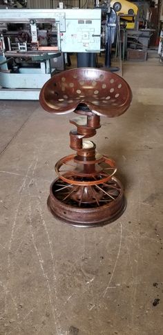 an old metal object sitting on top of a floor