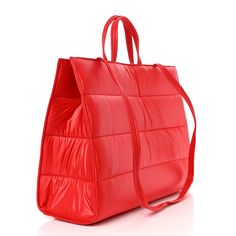 This is an authentic TELFAR Nylon Large Puff Shopping Bag in Red. This is a tote crafted of nylon in black with the iconic Telfar logo stitched on the front. The shoulder bag has short top handles, and two long shoulder straps. The top secures with a magnet snap and opens to a red fabric lined interior with zipper and patch pockets. 1382820 Quilted Nylon Top Handle Bag, Red Quilted Travel Shoulder Bag, Red Quilted Shoulder Bag For Travel, Red Quilted Travel Bag, Solid Color Nylon Shopping Bags, Top Handle Nylon Shopping Bag, Large Capacity Red Nylon Shoulder Bag, Trendy Red Nylon Shoulder Bag, Red Nylon Shopping Bag