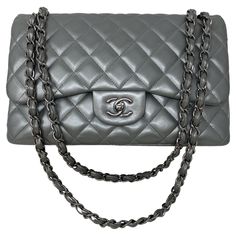 Chanel Silver Metallic Jumbo Double Flap Bag. Excellent condition. Unique silver lambskin leather bag. Silver hardware. Classic style bag with rare silver leather. Collector's piece. Includes dust cover and box. Guaranteed authentic. Chanel Quilted Bag, Handbag Cakes, Hermes Birkin Handbags, Birkin Handbags, Wedding Handbag, Handbag Storage, Work Handbag, Handbag Essentials, Bag Silver