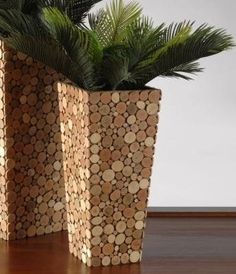 two planters made out of wood are sitting on the floor next to each other