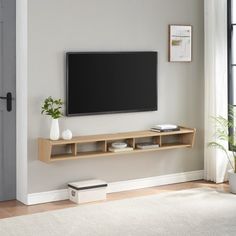 a flat screen tv mounted to the side of a wall