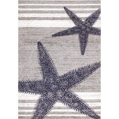 a rug with two starfishs on it and stripes in the background, one is gray