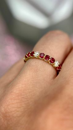 DETAILS: * Handmade item * Gemstone: Ruby, Natural Diamond * Gem color: Red * Band color: Yellow Gold (may vary on gold selection) * Condition: Never been Used; Made to order, Recycled Metal, Conflict-free 100% DESCRIPTION: 💎 Welcome to the Our Shop, Congratulations🍾 on discovering us. 💎 You'll be amazed at the beauty and delicate craftsmanship of this ring. This custom 18-karat gold stacking eternity ring features alternating 3 round rubies sitting side-by-side with one white diamond in a sh Elegant Ruby Ring, Ruby And Sapphire Rings, Ruby Diamond Eternity Band, Ruby And Diamond Eternity Ring, Diamond Ruby Ring, Brilliant Cut Ruby Gemstones For Fine Jewelry, Brilliant Cut Ruby Gemstones Fine Jewelry, Promise Ruby Ring With Cubic Zirconia, Diamond And Ruby Rings