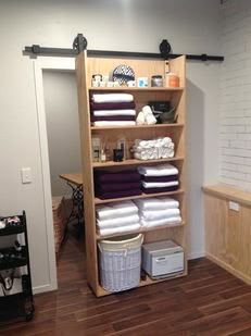 a closet with towels and other items in it