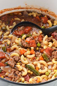 a large pot filled with pasta and vegetables