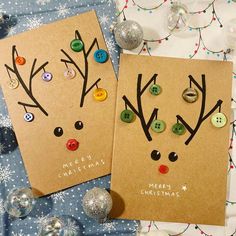 two christmas cards with buttons on them