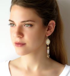 "I created this long bridal earring by hand, using gold plated brass flower, Swarovski pearls and beads 3mm, Swarovski teardrop 13*18, Miyuki Delica beads, Miyuki round seed beads, 14k gold filled chain and ear-wire * Measurements: Earrings length: 3.35\" (9cm) flowers diameter: 0.59\" (1.5cm) * The earrings will come beautifully packaged for a gift. * For other Bridal earrings: https://www.etsy.com/ca/shop/LioraBJewelry?ref=listing-shop2-all-items-count%C2%A7ion_id&section_id=16552834 * Sho Swarovski Crystal Chandelier, Teardrop Bridal Earrings, Long Bridal Earrings, Crystal Chandelier Earrings, Gold Fringe, Delica Beads, Swarovski Pearls, Fringe Earrings, Gold Filled Chain