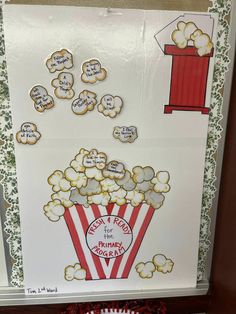 a popcorn themed bulletin board with words on it