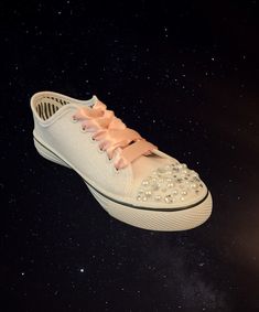 These custom sneakers have glitter as your shoe color, and pearl and rhinestone mix toe accents. The satin ribbon shoe lace and custom details will be in Light Pink color, other pictures to show details.  I can customize this shoe for any occasion, wedding, Quince, or anything you desire.  I make these per order, with glitter that does not rub off and the custom details are not iron on or paint, they are hand placed rhinestones. You chose your glitter, and provide the custom details, and I will Synthetic Lace-up Sneakers With Glitter Accents, White Low-top Custom Sneakers With Bling, Luxury Lace-up Custom Sneakers With Rhinestones, Metallic Low-top Sneakers With Glitter Accents, Pearl Embellished Lace-up Wedding Sneakers, Ribbon Shoe Laces, Ribbon Shoes, Bridal Sneakers, Pearl Shoes