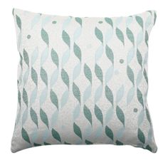 a green and white pillow with wavy lines on the front, along with a light blue background