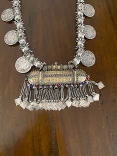 "Here is an amazing, original necklace from Oman. It measures approximately 37 3/4\" (95,8 cm) long. The main pendant measures 4 5/8\" (11,75 cm) long and ~ 5 3/4\" (14,6 cm) wide. This is wonderful vintage piece, in great shape commensurate with age and tribal use. It features gorgeous workmanship. It is strung on its original cotton cording. The darker material on the loop side is from incense, often applied to jewelry from this region. This piece is truly massive and weighs in at just over 71 Nakatomi Plaza, Original Necklace, Dark Material, Velcro Patches, Ethnic Necklaces, Ethnic Jewelry, Hook And Loop, Oman, Middle Eastern