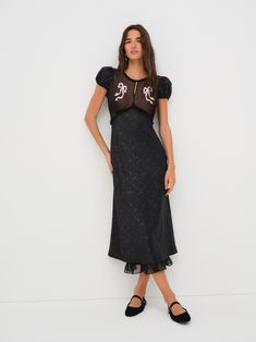 Embroidered with darling bow appliqués, the Catalina black midi dress is crafted is a floral jacquard with a contrast chiffon at the bust. Featuring puff sleeves and a flattering, body-skimming fit—this black slip dress is the perfect piece for a sultry winter party. Sultry Winter, Slip Dress Black, Black Slip Dress, Midi Slip Dress, Winter Party, Floral Jacquard, Wedding Lingerie, Black Midi, Feminine Beauty