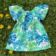 Watercolour Monstera Sun Dress These sweet little pixie style dresses are great for little ones! They fit for a long period of time, first as a dress then as a romper (worn with leggings) then a top as your child grows. Easy care, machine wash and tumble or hang to dry. Hand-made in Guelph Ontario with 100% cotton with high quality designer prints. Playful Green Dress For Beach, Playful Green Dresses For Beach, Playful Green Beach Dress, Cute Green Sundress For Vacation, Green Short Sleeve Playwear Dress, Whimsical Green Dress For Garden Party, Green Cotton Twirl Dress For Summer, Green Playful Twirl Dress For Summer, Playful Green Twirl Dress For Summer