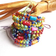 Colorful Beaded Bohemian Friendship Bracelets, Bohemian Beaded Colorful Friendship Bracelets, Multicolor Hand-strung Wrap Bracelet For Festival, Handmade Spiritual Friendship Bracelets For Festivals, Multicolor Bohemian Beaded Bracelets For Festivals, Bohemian Multicolor Beaded Bracelets For Festivals, Bohemian Hand Wrapped Wristband As Gift, Bohemian Hand Wrapped Wristband Gift, Colorful Beads Friendship Bracelets For Festivals