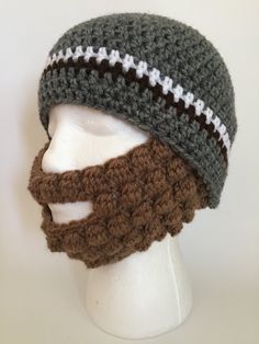 a crocheted hat with a beard and mustache on top of a mannequin head