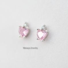 The pink color is vibrant and sweeps across the stone. The stone is a brilliant-cut style of tourmaline showing off the depths of pink that is completely mesmerizing and a tiny CZ on top of the heart-shaped Pink Simulated Tourmaline. 🎀 Material: 0.925 Sterling Silver 🎀 Finishing: High Polish, Rhodium plated (Anti-Tarnish) 🎀 Width: 5 mm 🎀Height: 6 mm 🎀 Shape: Heart 🎀 Closure: Push Back 🎀 Sold as a PAIR ✈️READY TO SHIP the next day! 🎀 Please note that pictures are magnified to show the det Pink Heart-shaped Gemstone Jewelry, Pink Heart Cut Gemstone Jewelry, Pink Heart-shaped Gemstone Earrings, Pink Heart Gemstone Earrings, Elegant Pink Cubic Zirconia Heart Earrings, Pink Fine Jewelry Heart Earrings As Gift, Pink Heart Earrings Fine Jewelry For Gifts, Pink Round Heart Earrings, Elegant Pink Heart Cut Earrings