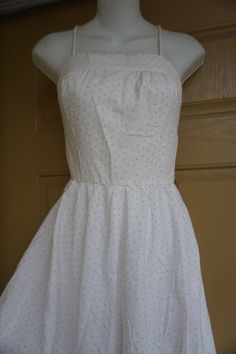 "Vintage 1980s white with pink polka dots sundress. Good condition but has a missing button in the back. Labeled size 5. Made by Bill Berman styled by Jodi Schwartz. Please see measurements prior to purchase. Measurements taken across front lying flat 16.5\" across front armpit to armpit 12\" across front of waist 27\" across front of hips 31\" length armpit to bottom" Fitted Polka Dot Sundress For Summer, Vintage White Sleeveless Sundress, White Sleeveless Vintage Sundress, Vintage White Fitted Sundress, White Fitted Vintage Sundress, Vintage White Cotton Sundress, White Vintage Cotton Sundress, Embroidered Robes, Large Photos