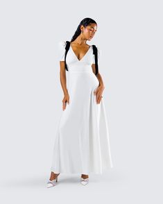 Be the girl of their dreams in this white maxi dress 😙 Made from crepe fabric and complete with velvet bows at the shoulders and puff sleeves, this look will have you looking like a walking fairytale 🤍 Fitted Maxi Length Puff Sleeve Party Dress, Fitted Maxi Length Puff Sleeve Dress For Party, Elegant White Puff Sleeve Evening Dress, Party Puff Sleeve Maxi Dress, White Floor-length Chic Maxi Dress, White Empire Waist Dress With Fitted Bodice, White Dress With Fitted Bodice And Empire Waist, Chic White Floor-length Maxi Dress, White Dressy Prom Dress