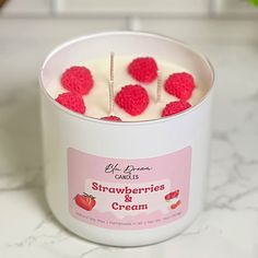 strawberries and cream in a white container on a counter