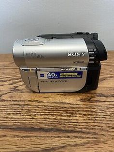 a sony camera sitting on top of a wooden table