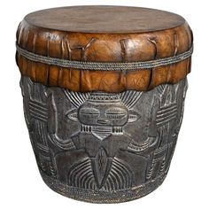 a wooden stool with an intricate design on it