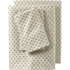 three folded napkins on top of each other in various patterns and colors, with one folded