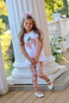 This shirt is sewn with our beautiful custom pumpkin vines fabric in monogram letters of your choice. Add the matching items below: Matching leggings and bows Ponytail Bow, Pumpkin Vine, Pigtail Bows, A Ponytail, Monogram Shirts, Matching Leggings, Ruffle Shirt, Monogram Letters, Matching Items