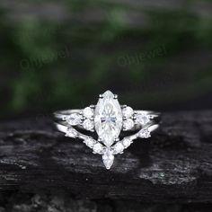 an engagement ring with three pear shaped diamonds