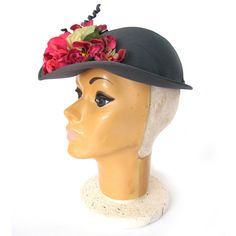 "This 1940s feminine hat has a a semi deep fitted crown with brim at the front that narrows as it wraps around the side. This is a charming round crown shell cap or bonnet, decorated with a striking arrangement of millinery flowers on the front brim. The color of the hat is a mid-value gray/green. The flower are hot pink, fuchsia and green. The spirals are wrapped in the same fabric that covers the hat. There is a white translucent cube hat pin in the back. This hat is in excellent condition. Si Classic Fitted Felt Cap, Retro Fitted Brimmed Felt Hat, Classic Fitted Cloche Cap, Classic Short Brim Hat For Garden Party, Classic Fascinator Hat, Classic Fitted Fascinator Hat, Fitted Fedora For Vintage Events, Victorian Fitted Brimmed Costume Hats, Fitted Brimmed Mini Hat For Church