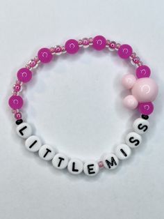 Be all the trend with this Little Miss bracelet. Beaded and stretchy with vibrant pink glass ball beads and a large mouse ears charm, everyone will know your Little Miss theme park obsessed! Bracelets are available in a variety of lengths.  Pick your custom length from the drop down menu below.  All our bracelets are made with quality in mind.  With that being said, all bracelets should be treated with care while putting on, wearing, and taking off.  Keep dry. Do not swim or bath with them. Theme Park Fashion, Costume Bracelets, Park Day, Barbie Costume, Trend Jewelry, Water Mixes, Princess Baby, Handmade Jewelry Tutorials, Bracelet Beaded