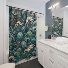 a bathroom with an octopus shower curtain in it