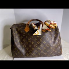 Authentic Lv Bag In Great Shape! Luxury Monogram Canvas Bag, Luxury Satchel With Dust Bag Included, Designer Travel Bag With Monogram Print, Travel Bags With Monogram Print And Double Handle, Travel Bag With Monogram Print And Double Handle, Travel Tote Bag With Monogram Print, Luxury Bag With Monogram Print And Double Handle, Luxury Monogram Canvas Bags With Monogram Detail, Designer Monogram Canvas Bags