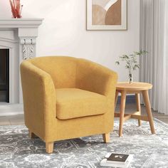 a yellow chair sitting on top of a rug next to a fire place in a living room