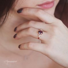 a close up of a person wearing a ring